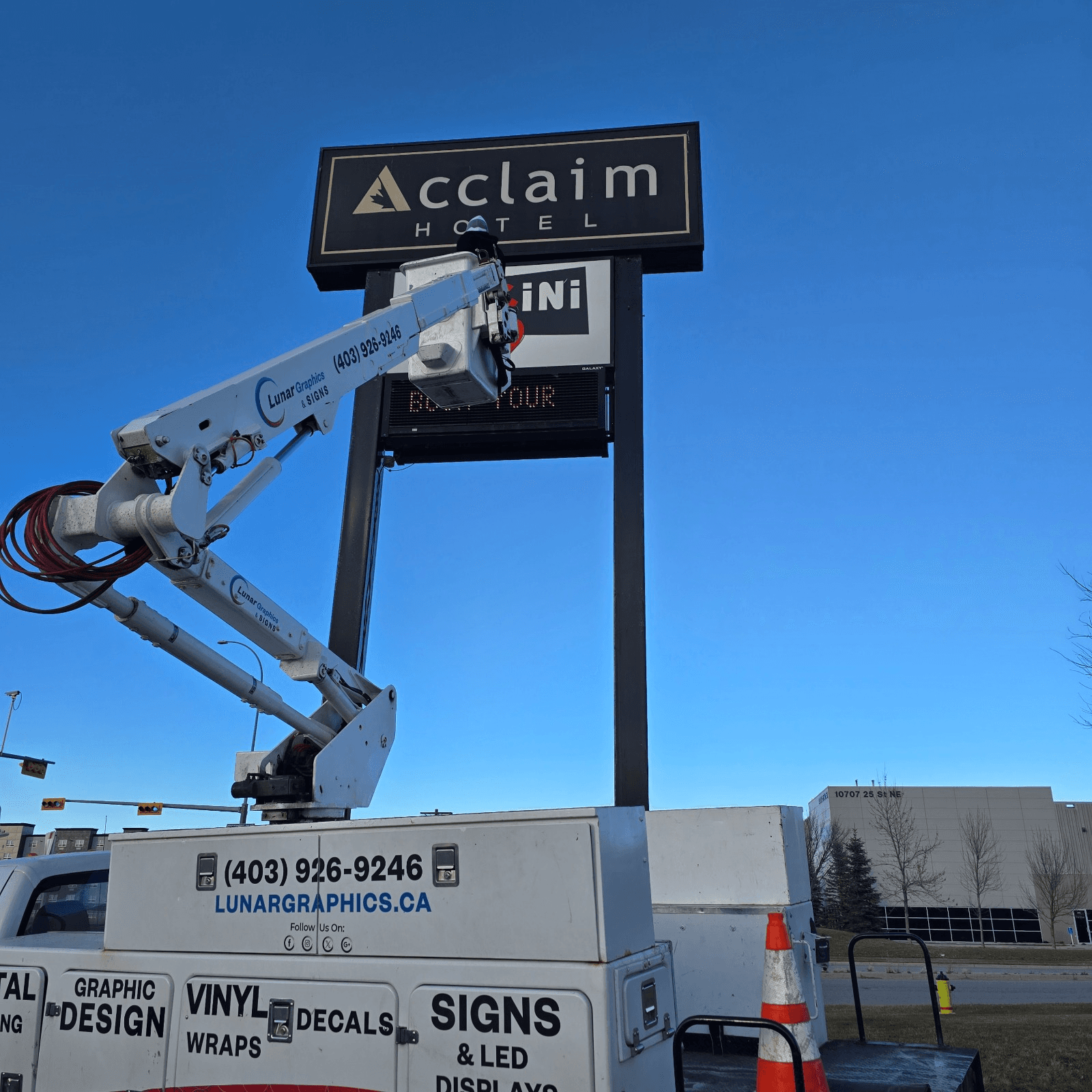 Lunar Graphics Calgary commercial signage installation with boom truck